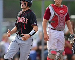 STRUTHERS, OHIO - MAY 15, 2018: Canfield's Anthony Longo celebrates after scoring a run on double by Ian McGraw in the fifth inning of their OHSAA tournament game on Tuesday afternoon at Cene Park. Canfield won 4-3. DAVID DERMER | THE VINDICATOR..Mooney catcher Jake Fonderlin pictured.