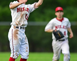 STRUTHERS, OHIO - MAY 15, 2018: Niles' Luke Swauger catches a fly ball for the out in the seventh inning of their OHSAA tournament game on Tuesday afternoon at Cene Park. Niles won 4-3. DAVID DERMER | THE VINDICATOR