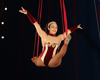    ROBERT K YOSAY  | THE VINDICATOR..Elena Sanders does acrobatic ribbon dance high up in the Big Top..The Zoppe Family Circus is returning to the Canfield Fairgrounds May 16-20 for 12 shows..Founded in 1842, the Zoppe Family Circus is a one-ring circus under the big top featuring acrobats, equestrian showmanship, canine tricks, clowns and plenty of audience participation. ...-30-