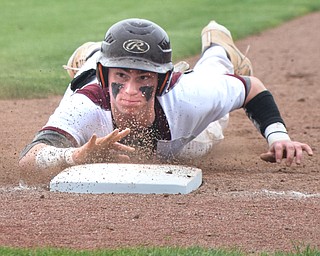 William D. Lewis The Vindicator  South Range's Jared Bajerski(18) dives back to first in a pick off attempt during 5-16 action with Crestview.