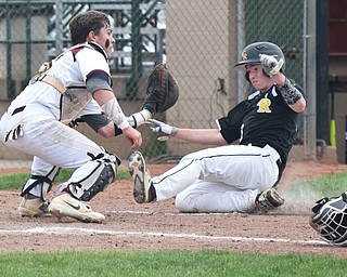 William D. Lewis The Vindicator  Crestview's Keith Berger(20) is out as South Range catcher Jared Bajerski(18) makes the tag during 5-16 action at Cene.