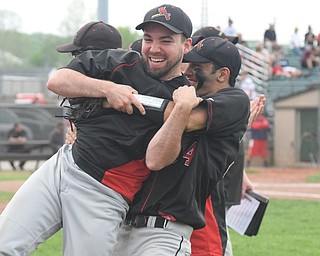 William D. Lewis The Vindincator Canfield assist coach Ryan Halicki is lifted up by Alex Hernandez(34) during win over Niles 5-17-18.