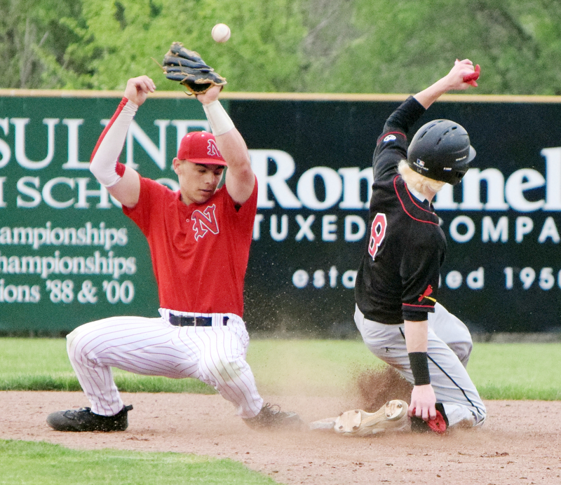 William D. Lewis The Vindincator Canfield'sNick Piersante(8) is safe at 2nd as Joe Corson(1) looses control of the ball.