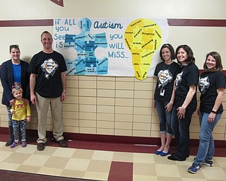 Neighbors | Zack Shively.Stadium Drive Elementary used the Light It Up Blue assembly on April 13 to discuss autism and the acceptance of others who have autism. Each year, the school has the program in April, National Autism Awareness Month. Pictured are, from left, PTA member Diana Bugno, principal Michael Zoccali, special education teacher Jessica Schubert, and PTA members Jaime Miller and Erin Vondran.