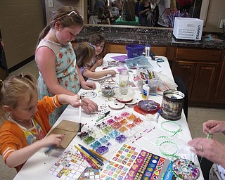 Neighbors | Zack Shively.The Austintown Farmers' Market had a special event for Mother's Day. The event included their usual group of vendors at Austintown Township Park, but they included some Mother's Day related activities. Pictured, children made gifts for their mothers for a small donation to Austintown's Relay For Life.
