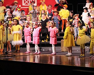 Neighbors | Abby Slanker.A group of C.H. Campbell Elementary School kindergartners dressed as barnyard chicks and piggies sang “Cute Chicks” during the school’s annual performance of “E-I-E-I Oops!” on May 14.