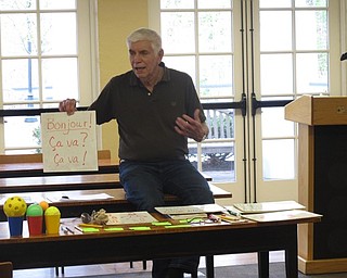 Neighbors | Zack Shively.Retired teacher Ron Saffell taught a French lesson at the Poland library on May 7. He went over common phrases and basic language lessons. Pictured, Saffell taught the group how to say "Hello" and "How are you?"