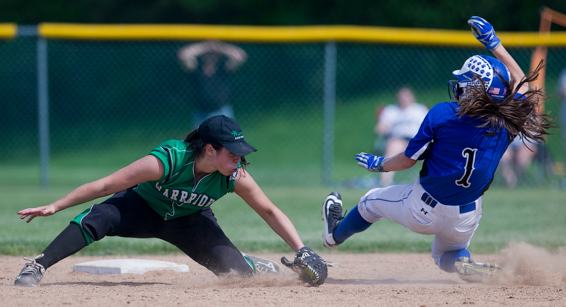 ALLIANCE, OHIO - MAY 17, 2018, Softball Poland Bulldogs vs West Branch Warriors: West Branch's Delaney Rito (22) tags out Poland's Brooke Bobbey(1) attempting to steal 2nd base during the 5th inning at Alliance High School.  MICHAEL G. TAYLOR | THE VINDICATOR