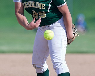 ALLIANCE, OHIO - MAY 17, 2018, Ursuline Irish vs Mooney Cardinals: Ursuline's Jordyn Keneally (99) fires the pitch homeward during the 1st inning at Alliance High School.  MICHAEL G. TAYLOR | THE VINDICATOR