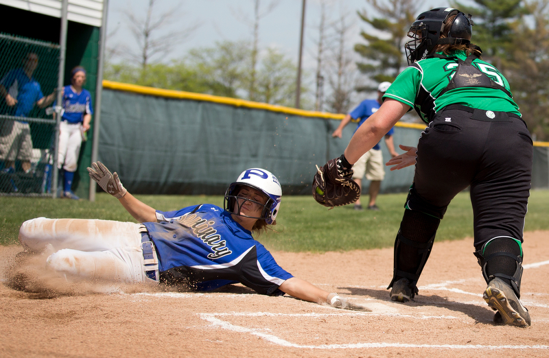 ALLIANCE, OHIO - MAY 17, 2018, Softball Poland Bulldogs vs West Branch Warriors: Poland's Sarah Bo-Cherry (12) slides safely into home scoring Poland's second run during the 1st inning at Alliance High School.  MICHAEL G. TAYLOR | THE VINDICATOR