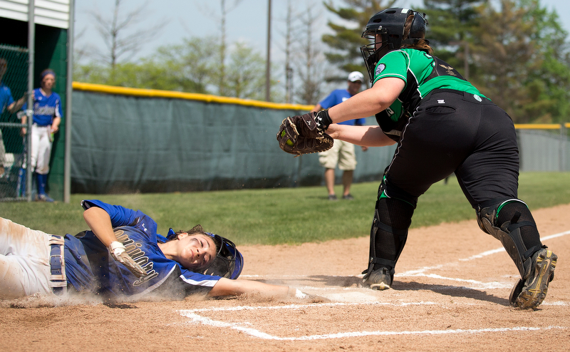 ALLIANCE, OHIO - MAY 17, 2018, Softball Poland Bulldogs vs West Branch Warriors: Poland's Sarah Bo-Cherry (12) eludes the tag of West Branch'sSam Morris (25)  scoring Poland's second run during the 1st inning at Alliance High School.  MICHAEL G. TAYLOR | THE VINDICATOR
