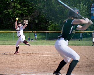 ALLIANCE, OHIO - MAY 17, 2018, Ursuline Irish vs Mooney Cardinals: Mooney's Kayla Rutherford (44) fires the pitch homeward during the 1st inning at Alliance High School.  MICHAEL G. TAYLOR | THE VINDICATOR