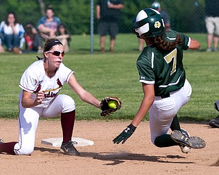 ALLIANCE, OHIO - MAY 17, 2018:  Cardinal Mooney's Kelly Williams (24) tags out Ursuline's Destiny Goodnight  (7) attempting to steal 2nd base during the 1st inning at Alliance High School.  MICHAEL G. TAYLOR | THE VINDICATOR