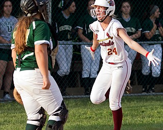 ALLIANCE, OHIO - MAY 17, 2018:  Cardinal Mooney's Kelly Williams (24) celebrates scoring the winning run during the 7th inning at Alliance High School.  MICHAEL G. TAYLOR | THE VINDICATOR