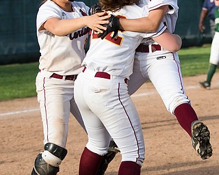 ALLIANCE, OHIO - MAY 17, 2018, Ursuline Irish vs Mooney Cardinals:  Cardinal Mooney teammates Conchetta Rinaldi (26), CJ Sapp (22) and Lexi Diaz (11) celebrate their victory over Ursuline at Alliance High School.  MICHAEL G. TAYLOR | THE VINDICATOR