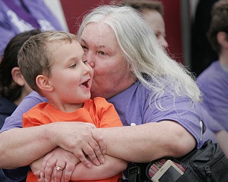 William D. Lewis The Vindicator Five -year Cancer survivor Kathy Allen of Boardman kisses her grand nephew Brady Smith, 4, during Boardman Relay for Life 5-18-18.