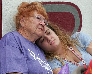 William D. Lewis The Vindicator 36-year cancer survivor Maria Neopolitian of North Lima shares a moment with her grandaughter Lauren Neopolitan during Boardman Relay for Life 5-18-18.