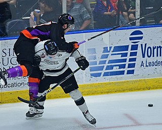 YOUNGSTOWN, OHIO - MAY18, 2018: Phantoms' Joey Abate is checked by Ty Farmer during Friday nights Clark Club Final game at the Covelli Centre. DAVID DERMER | THE VINDICATOR