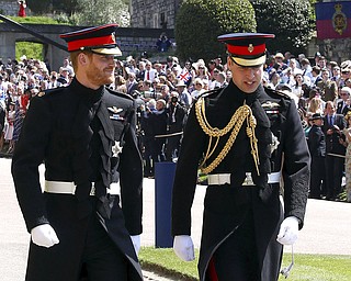 Britain's Prince Harry, left, and Prince William arrive for the wedding ceremony of Prince Harry and Meghan Markle at St. George's Chapel in Windsor Castle in Windsor, near London, England, Saturday, May 19, 2018. (Chris Radburn/pool photo via AP)