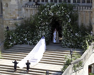 Meghan Markle arrives for the wedding ceremony of Prince Harry and Meghan Markle at St. George's Chapel in Windsor Castle in Windsor, near London, England, Saturday, May 19, 2018. (Andrew Matthews/pool photo via AP)