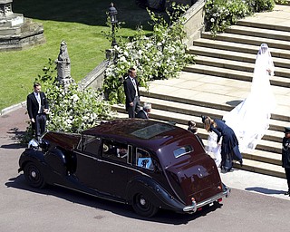 Meghan Markle arrives for the wedding ceremony of Prince Harry and Meghan Markle at St. George's Chapel in Windsor Castle in Windsor, near London, England, Saturday, May 19, 2018. (Andrew Matthews/pool photo via AP)