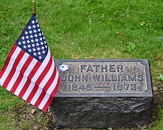 YOUNGSTOWN, OHIO - MAY 19, 2018: The tombstone of John Williams with a US Veteran striker and a US flag, Saturday morning at the Oak Hill Cemetery. DAVID DERMER | THE VINDICATOR