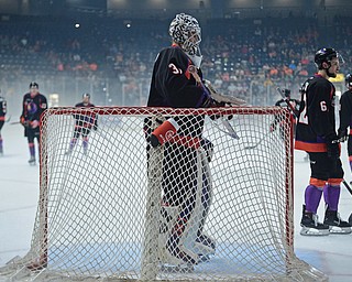 YOUNGSTOWN, OHIO - MAY 19, 2018: Youngstown goalie Ivan Prosvetov stands while Phantoms players skate around behind him during a delay for fog that built up on the ice during the first period of game 4 of the Clark Cup Final, Saturday night at Covelli Centre. DAVID DERMER | THE VINDICATOR