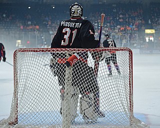 YOUNGSTOWN, OHIO - MAY 19, 2018: Youngstown goalie Ivan Prosvetov stands while Phantoms players skate around behind him during a delay for fog that built up on the ice during the first period of game 4 of the Clark Cup Final, Saturday night at Covelli Centre. DAVID DERMER | THE VINDICATOR