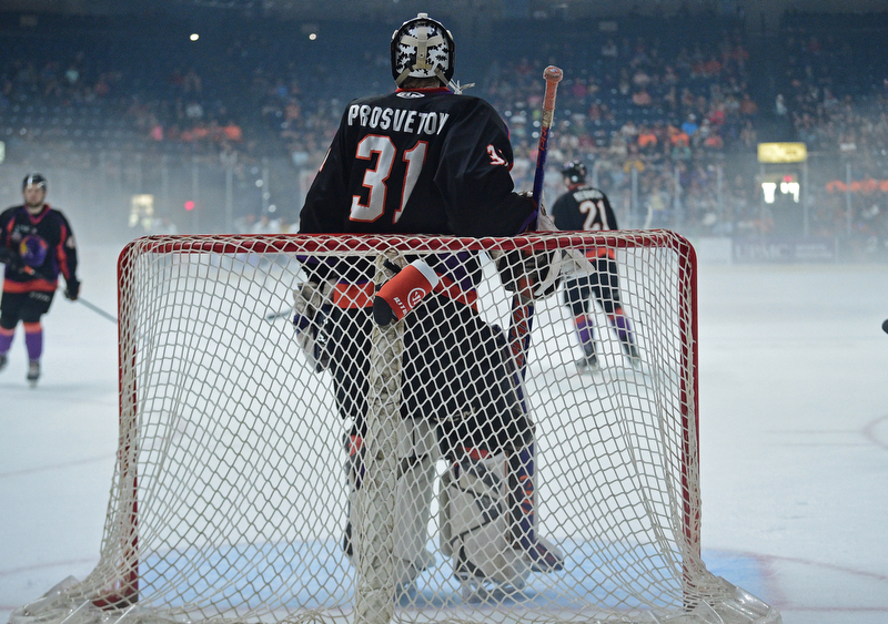 YOUNGSTOWN, OHIO - MAY 19, 2018: Youngstown goalie Ivan Prosvetov stands while Phantoms players skate around behind him during a delay for fog that built up on the ice during the first period of game 4 of the Clark Cup Final, Saturday night at Covelli Centre. DAVID DERMER | THE VINDICATOR