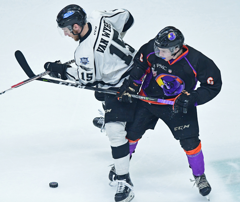YOUNGSTOWN, OHIO - MAY 19, 2018: Fargo's Garrett Van Wyhe and Youngstown's Max Ellis battle for the loose puck near center ice during the second period of game 4 of the Clark Cup Final, Saturday night at Covelli Centre. DAVID DERMER | THE VINDICATOR