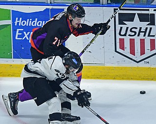 YOUNGSTOWN, OHIO - MAY 19, 2018: Youngtsown's Samuel Salonen and Fargo's Griffin Loughran battle for the puck in the neutral zone during the second period of game 4 of the Clark Cup Final, Saturday night at Covelli Centre. DAVID DERMER | THE VINDICATOR