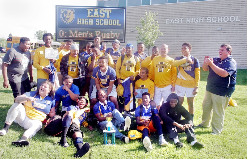 The East High School rugby team celebrates after winning the Division 3 state championship. In Canton Sunday, East defeated Northwest and Shaker Heights.