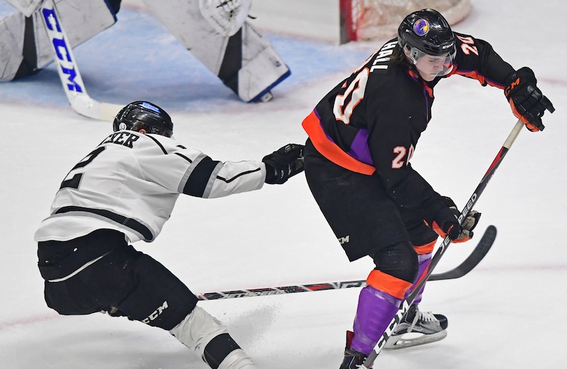 Phantoms forward Curtis Hall looks for the puck while being checked by Fargo’s Robbie Stucker during Friday’s game at the Covelli Centre. Hall is projected to be a fourth-round selection in June’s NHL Draft.