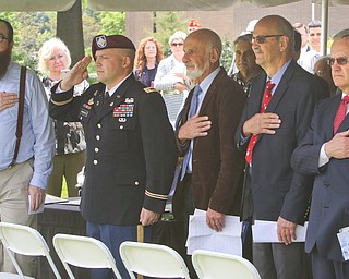 ROBERT K YOSAY  | THE VINDICATOR..l-r - Tom Erickson LTC Gerald Nunziato Jr- Tom and Jerry Nunziato and President James Tressel..dedication ceremony Wednesday in which the Youngstown State University Office of Veterans Affairs, 633 Wick Ave., was renamed the Carl A. Nunziato Veterans Resource Center....-30-