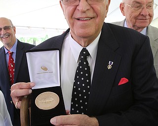 ROBERT K YOSAY  | THE VINDICATOR..Carl and his Vietnam Medal awarded to him today..dedication ceremony Wednesday in which the Youngstown State University Office of Veterans Affairs, 633 Wick Ave., was renamed the Carl A. Nunziato Veterans Resource Center....-30-