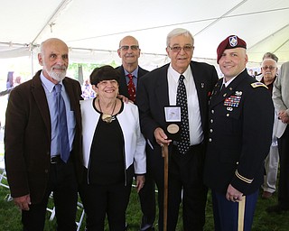 ROBERT K YOSAY  | THE VINDICATOR..Tom Nunziato (brother) Clare ( Carls Wife ) Jerry Nunziato - Carl and Carl Nunziato Jr ( nephew )...dedication ceremony Wednesday in which the Youngstown State University Office of Veterans Affairs, 633 Wick Ave., was renamed the Carl A. Nunziato Veterans Resource Center....-30-