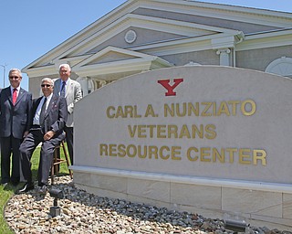 ROBERT K YOSAY  | THE VINDICATOR..President James Tressel - Carl Nunziato and Bernie Kosar...dedication ceremony Wednesday in which the Youngstown State University Office of Veterans Affairs, 633 Wick Ave., was renamed the Carl A. Nunziato Veterans Resource Center....-30-