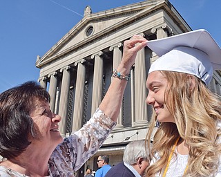 William D. Lewis The Vindicator Hubbard grad Adria Powell gets help with mortar board from her grandmother Melissa McFarland prior to commencement at Stambaugh auditorium 5-23-18.