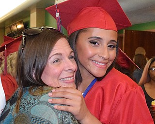 William D Lewis The Vindicator   Niles graduate Zia Williams gets a hug from her mother Rachel Williams during 5-23-18 commencement at Packard Music Hall in warren.