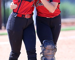 AKRON, OHIO- 05-23-18 SOFTBALL D1 Regional Semi- Canfield Cardinals vs Willoughby South Rebels: Canfield teammates Kailn Kovach(20) (left) and Chloe Cruz (32) (right) console each other after their defeat at University of Akron, Lee Jackson Softball Field.  MICHAEL G. TAYLOR | THE VINDICATOR