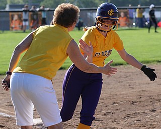 Massillon, OHIO- 05-23-18 SOFTBALL D3 Regional Semi- Manchester Panthers vs Champion Flashes: Champion's Cassidy Shaffer (9) is greeted by head coach Cheryl Weaver on her home run trot during the 6th inning at Massillon Washington HS.  MICHAEL G. TAYLOR | THE VINDICATOR