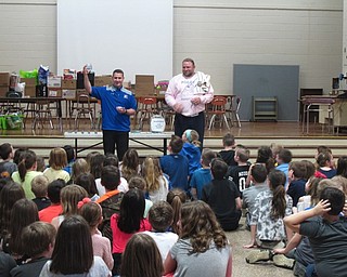 Neighbors | Zack Shively.Dobbins Elementary principal Michael Daley rewarded the students for their hard work during the school's read-a-thon program. Pictured, he and Nick Blanch drew names from a raffle.