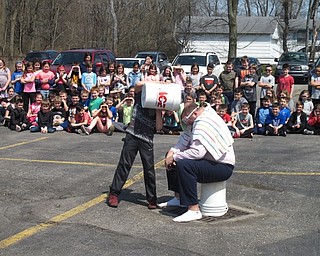 Neighbors | Zack Shively.Dobbins Elementary's read-a-thon also acted as a fundraiser for the school's PTO. The students raised $8,812.76 during the program. The students who earned the most pledge money got the chance to dump buckets of slime on teacher Nick Blanch. Pictured, Alex Cook poured smile on Blanch.