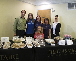 Neighbors | Zack Shively.First-grade student Brynna Jones set up her second bake sale for Angel for Animals with the help of her family at Fred Astaire Youngstown. She wanted to help the organization's capital campaign because she adopted her cat from the group. Pictured are, from left, Dustin Jones, Lauren Potts, Lindsay Jones, Donna Taylor Leesha Thompson with Brynna Jones.