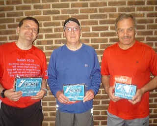 Neighbors | Submitted.Men’s Masters winners, from left, Heath Morgan (first place), John Monnin (second place) and Gary Smesko (third place) posed for a picture after the race on May 12.