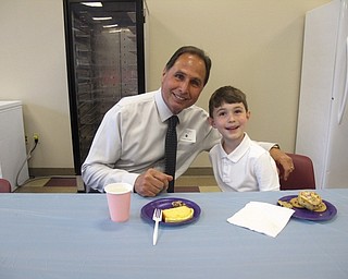 Neighbors | Zack Shively.St. Charles School had a VIP Day on May 10 where students invited loved ones to the school for the morning. These important people were parents, grandparents, siblings and neighbors. Pictured, Joseph Dagati and his grandson Maximus Marino had breakfast together at the event.