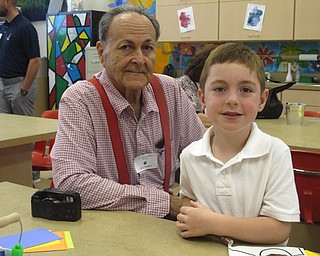 Neighbors | Zack Shively.The home and school organization set up St. Charles School's VIP Day. One of the activities they planned for the guests and students was making cards for children without a VIP at the school in the art room. Pictured, Andrew Tuscano and his guest Larry made cards together.