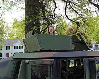 Neighbors | Abby Slanker.A Hilltop Elementary School third-grader poked her head out of the top of an Army Humvee while she was getting an up close look during the school’s annual Vehicle Career Day on May 18.