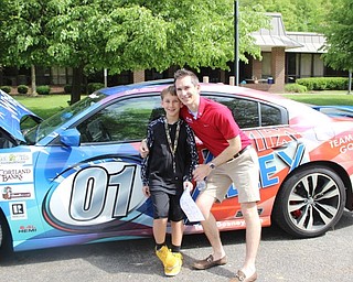 Neighbors | Abby Slanker.Rollin Gosney, with his son Hilltop Elementary School third-grader Preston, brought his Team Gosney Remax Valley Real Estate race car to the school’s annual Vehicle Career Day.