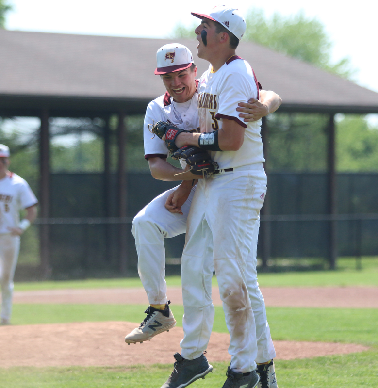 South Range pitcher Jake Gehring (9) celebrates with teammate Mike Cunningham (3) after recording a strikeout for the final out during Thursday afternoons matchup against Waynedale at Massilon High School. Dustin Livesay  |  The Vindicator  5/24/18  Massilon